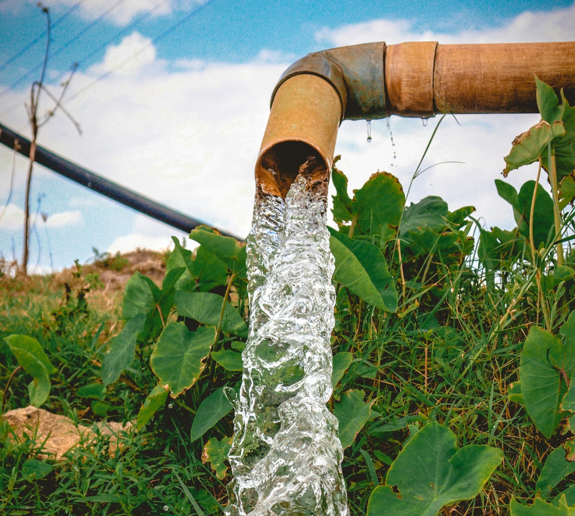a pipe that has water coming out of it